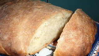 Белый хлеб на воде свежих дрожжах в виде батона